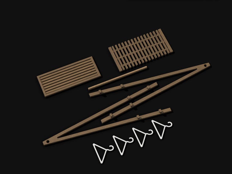 May include: A set of unassembled wooden furniture components including two rectangular slatted panels, three long support beams with small protruding pegs, and four small white triangular hangers arranged on a dark background.