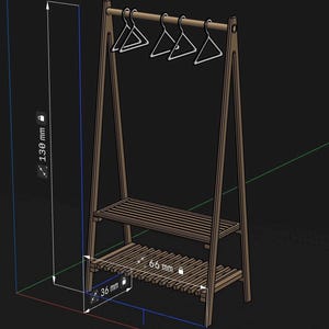 May include: A brown wooden A-frame garment rack with two slatted shelves and a top hanging rod holding four white hangers. The structure features technical dimension labels showing a height of 130 mm, a width of 66 mm, and a depth of 36 mm.