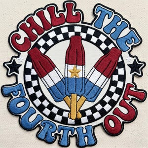 May include: A circular embroidered patch featuring three red, white, and blue rocket popsicles with yellow sticks. The center design is surrounded by a black and white checkered border and the text CHILL THE FOURTH OUT in red and blue.