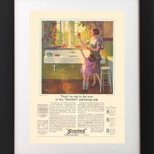 May include: A vintage advertisement for "Standard" acid-resisting sinks. The ad features a mother and daughter in a kitchen with a white sink. The text highlights the durability and long-lasting quality of the sink.  There's no end to the wear of this "Standard" acid-resisting sink.