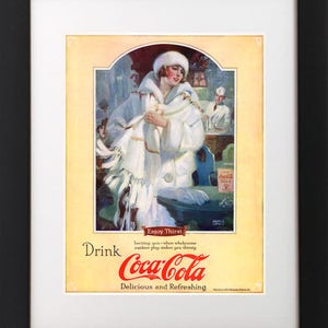 May include: Vintage Coca-Cola advertisement featuring a woman in a white fur coat and hat, standing in a snowy setting. The text reads "Drink Coca-Cola, Delicious and Refreshing."