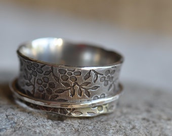 Sterling silver blossom spinner ring, hand forged