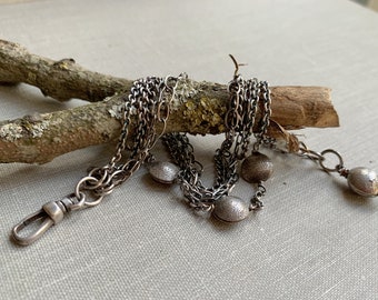 Sterling silver multi chain bracelet with hand forged beads