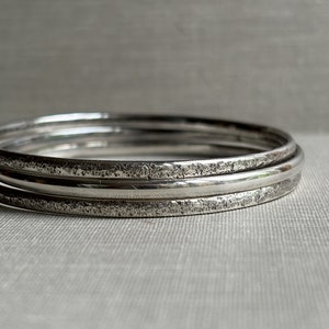 Set of three sterling silver bangles, hand forged, unique
