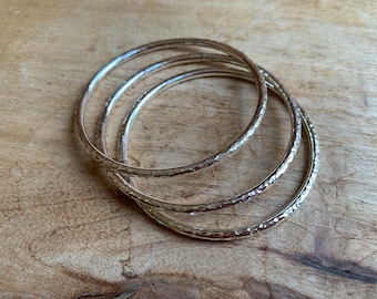 Set of three sterling silver hammered bangles, hand forged, unique