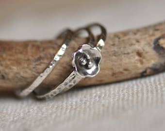 Three sterling silver hammered stacking rings with flower, hand forged