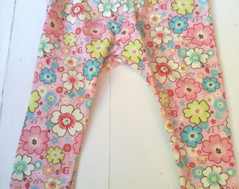 Baby floral leggings in a pretty pink print. Soft knit with fabric covered elastic waistband.  Size 3-6 months. Last one!