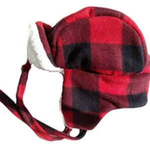 Winter trapper hat for adults in a buffalo plaid with cream or black colored sherpa lining to keep you warm. Fits up to 25" around.