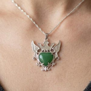 Certified green aventurine heart pendant necklace with sterling silver crown and wing design, natural healing crystal jewelry for heart chakra balance and positive energy.