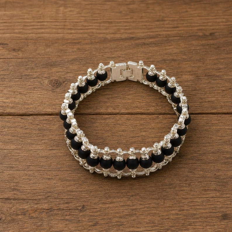 Natural karungali bracelet with black wooden round beads and silver finish, certified traditional protection jewelry.