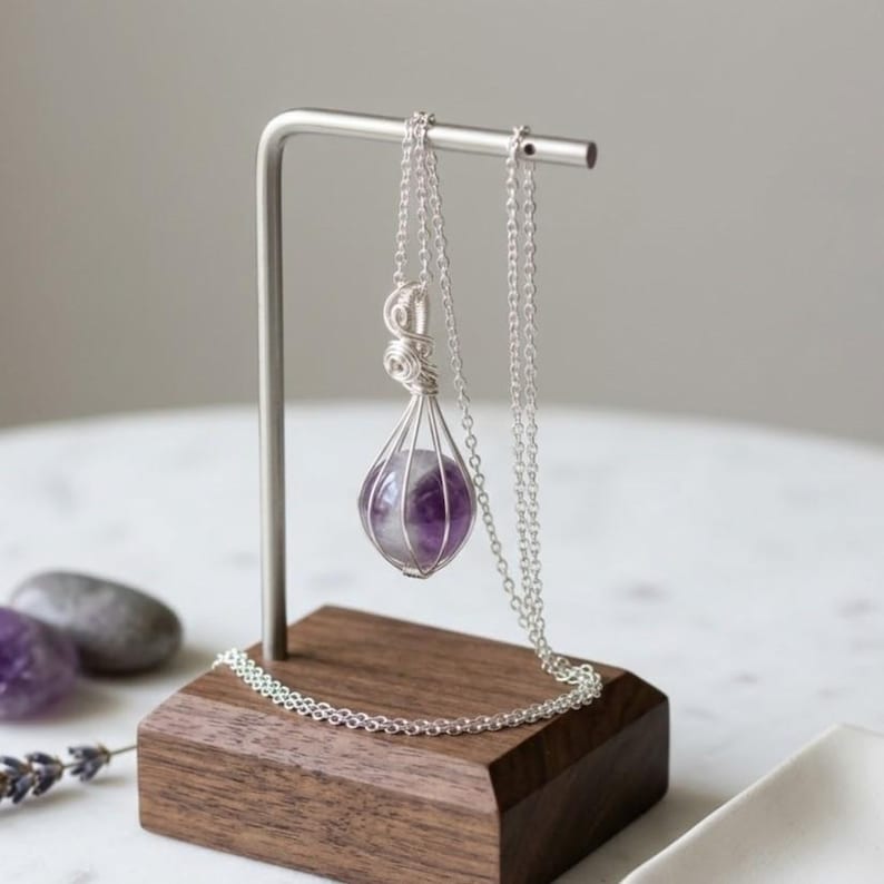 Detailed view of certified natural amethyst round gemstone pendant highlighting smooth polished surface and rich purple hues.