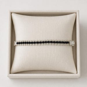 Traditional karungali protective bracelet with smooth round beads.