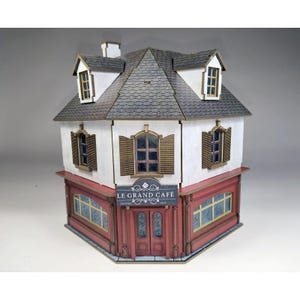 May include: A set of three ceramic mugs with a speckled, matte finish. The mugs are in shades of cream, light gray, and dark gray. Each mug has a simple, minimalist design, perfect for coffee or tea.