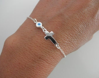 Cross and evil eye bracelet on sterling silver chain