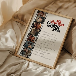 May include: A framed print with the text "10 things I love about you" in red and black. The print includes a film strip of photos and a list of loving sentiments. The frame is a light wood color.