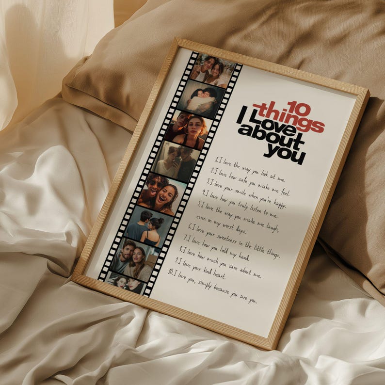 May include: A framed print with the text "10 things I love about you" in red and black. The print includes a film strip of photos and a list of loving sentiments. The frame is a light wood color.
