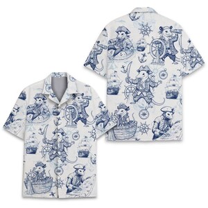 May include: A short-sleeved button-down shirt in white featuring an all-over blue ink-style print of opossums dressed as pirates. The pattern includes illustrations of opossums with swords, telescopes, and ships, along with nautical motifs like anchors and wheels.