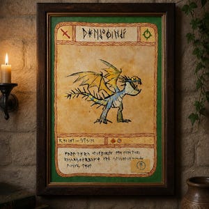 May include: Framed artwork featuring a dragon illustration with yellow and blue wings, set against a parchment-like background. The artwork includes text in a stylized font, framed in dark wood with a green border. A candle and a vase are visible.