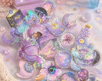 May include: A collection of iridescent stickers with a magical witchy theme. The stickers feature various designs, including crystals, moons, potion bottles, and a book with the word "Magic". The color palette includes shades of purple, blue, and pink.