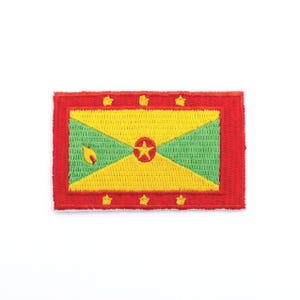 May include: Embroidered patch featuring the flag of Grenada. The rectangular patch has a red border and a central design with yellow, green, and red elements. A star is in the center, with other stars and a nutmeg on the flag.