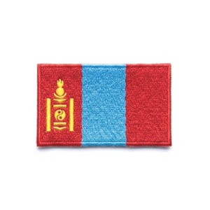 May include: Embroidered patch featuring the flag of Mongolia. The rectangular patch has a red background with a vertical blue stripe in the center. The left side features a yellow Soyombo symbol.