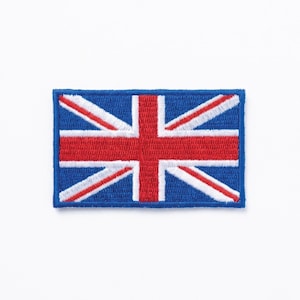 May include: A rectangular embroidered patch depicting the Union Jack flag. The patch features a blue background with a red and white cross design, representing the United Kingdom. The patch is a vibrant and detailed design.