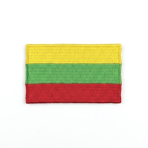 May include: Embroidered patch featuring the flag of Lithuania. The rectangular patch displays three horizontal stripes: yellow at the top, green in the middle, and red at the bottom. The patch is on a white background.