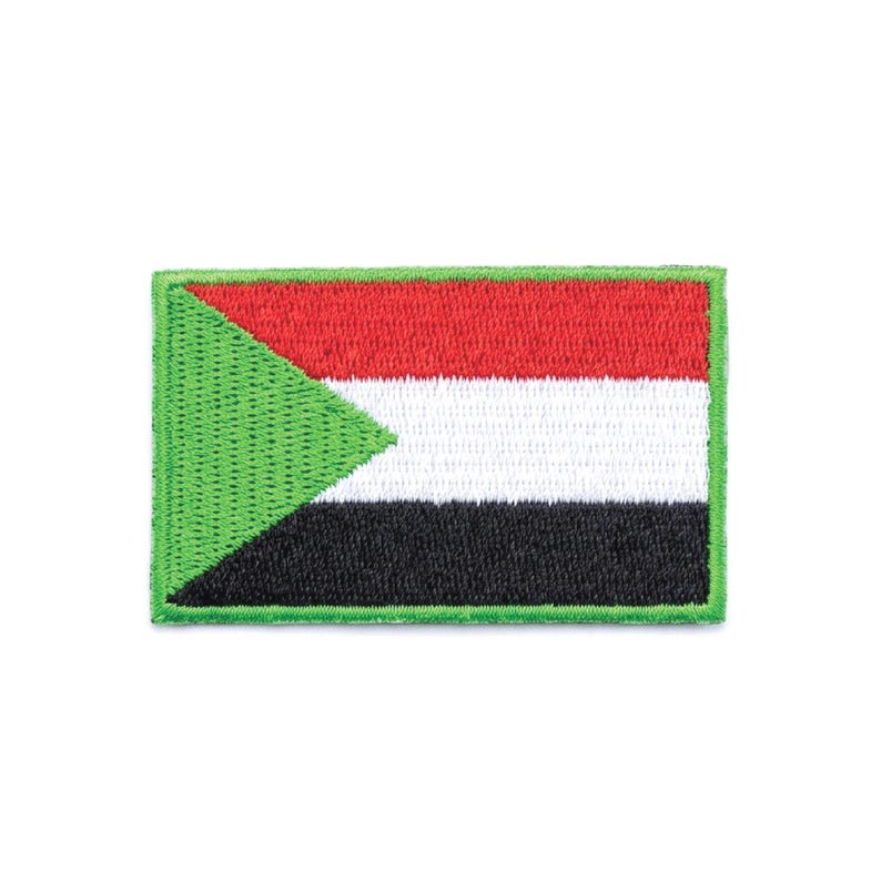 May include: Embroidered patch featuring the flag of Sudan. The flag design includes a green triangle, red, white, and black horizontal stripes, and a green border. The patch is rectangular and has a stitched appearance.