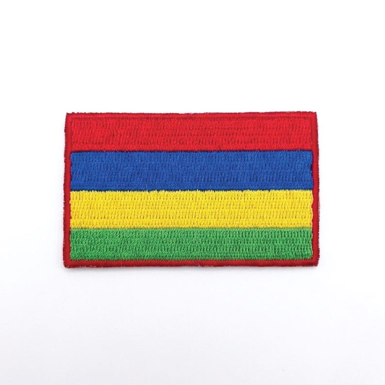 May include: Embroidered patch featuring a rectangular design with horizontal stripes. The top stripe is red, followed by blue, yellow, and green stripes. The patch has a red border and is set against a white background.