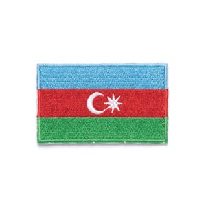 May include: Embroidered patch featuring the flag of Azerbaijan. The flag design includes a light blue stripe at the top, a red stripe in the middle with a white crescent and star, and a green stripe at the bottom.
