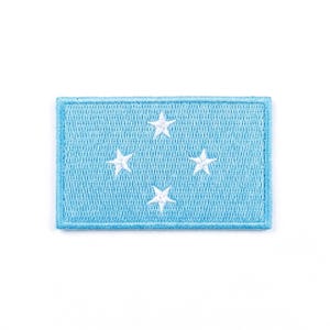 May include: A rustic wooden sign with the text "Welcome to our home" in white lettering. The sign features a distressed finish and a simple, inviting design, perfect for entryway decor.