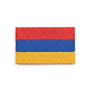 May include: Embroidered patch featuring the flag of Armenia. The rectangular patch displays three horizontal stripes: red at the top, blue in the middle, and yellow at the bottom. The patch is on a white background.