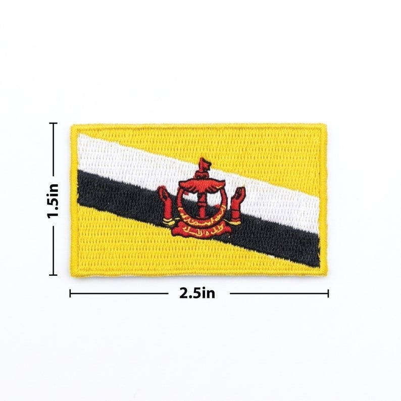 May include: Embroidered patch featuring the flag of Brunei. The rectangular patch is 2.5 inches long and 1.5 inches high. The flag design includes a yellow background, a white and black diagonal stripe, and a red emblem.