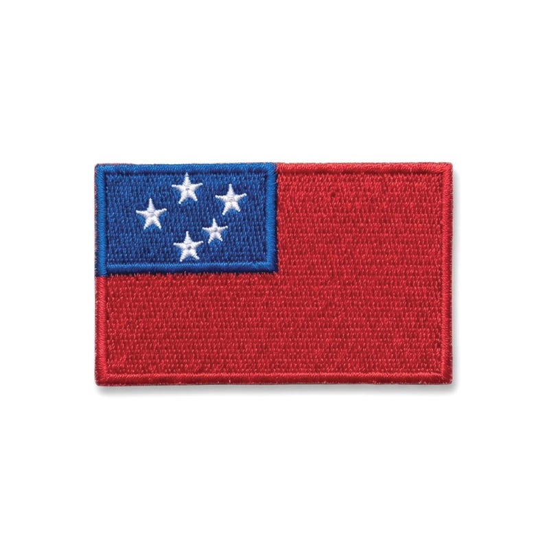 May include: Embroidered patch featuring the flag of Samoa. The rectangular patch has a red field with a blue square in the upper left corner. Five white stars are arranged in the blue square, representing the Southern Cross constellation.