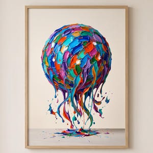 Può includere: Una stampa d'arte da parete incorniciata che presenta una forma sferica composta da spesse pennellate materiche in tonalità vivaci di blu, arancione, viola, verde e rosa, con vernice colorata che cola verso il basso su una superficie.