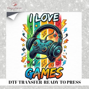 May include: A colorful graphic design featuring a black video game controller wearing large headphones. The text I LOVE GAMES is displayed in bold, vibrant letters. The background includes vertical rainbow stripes, yellow lightning bolts, and small stars.