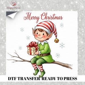 May include: A DTF transfer featuring a cartoon elf with brown hair, wearing a red and white striped hat with a bell, a green tunic, and red and white striped leggings, sitting on a branch holding a gift with a red bow, with Merry Christmas text.