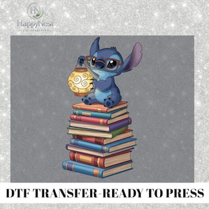 May include: A blue cartoon character wearing glasses and holding a lantern sits on a pile of books. The books have different coloured spines. The image includes the text "DTF TRANSFER-READY TO PRESS".