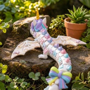 Flexible Rainbow Unicorn Dragon STL showing smooth articulated movement and detailed flower decorations.