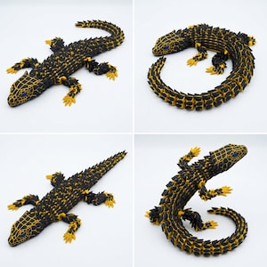 May include: An articulated lizard figurine featuring a black and yellow segmented body with a textured, spiky appearance. The lizard has bright blue eyes and four legs with yellow claws, shown in four different poses to demonstrate its flexibility.