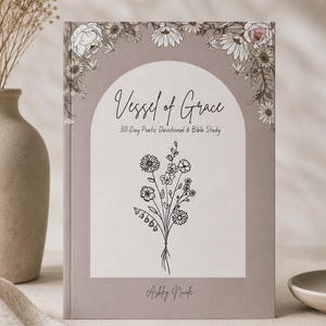 May include: A hardcover book titled "Vessel of Grace" with floral illustrations. The cover is a muted taupe color with an arched design. The book features the text "30-Day Poetic Devotional & Bible Study" and the author's name, Ashley Nicole.