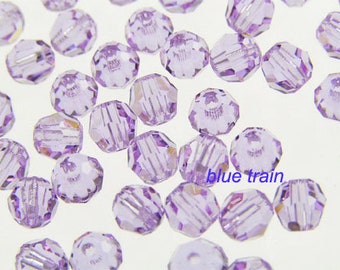 May include: A large quantity of small, faceted, lavender-colored glass beads. The beads are round and have a slightly iridescent finish.