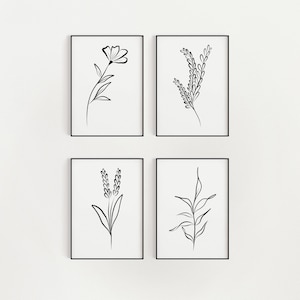 Puede incluir: Conjunto de cuatro impresiones en blanco y negro de diseños de arte lineal con motivos florales. Cada impresión está enmarcada en un marco negro y se muestra en una pared blanca.