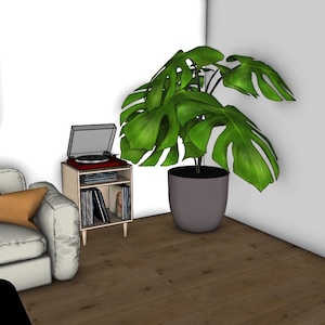 Peut inclure: Intérieur de salon moderne avec un canapé blanc, des coussins orange et jaunes, une impression encadrée de chat, une platine vinyle sur un support en bois et une grande plante en pot avec des feuilles vertes.