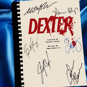 May include: A script for the television show "Dexter" with the show's title in red and signatures. The script is bound with a black spine and features the text "Directed By Michael Cuesta" and "Written By James Manos Jr."