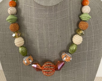 Chunky necklace set in greens, oranges, and cream