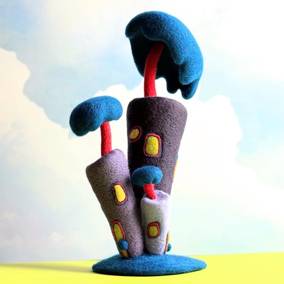 A surrealist needle-felted wool house sculpture — architectural, dreamlike, and the kind of OOAK object that makes guests stop and ask 'where did you get that?'