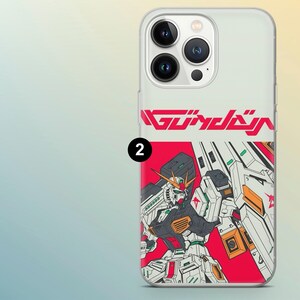 May include: Transparent phone case with a vibrant robot illustration and the word "GUNDAM" in red. The robot is depicted in white, black, red, and orange. The number "2" is printed in black on the case.