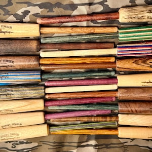 May include: A rustic wooden sign with the text "Welcome to our home" in white lettering. The sign features a distressed finish and a simple, inviting design, perfect for entryway decor.