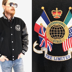 Chaqueta con letras de lana vintage de los años 80. Chaqueta de cuero negro con bordado Letterman, estilo bomber, estilo militar, con bandera de EE. UU., talla M para hombre o L para mujer.